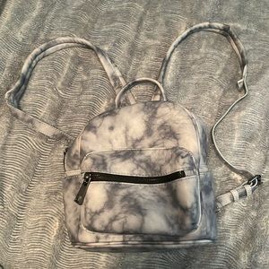 adorable mini backpack with adjustable straps and convenient storage space!